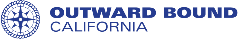 The image displays the logo for Outward Bound California. The logo features a circular emblem on the left side and the words "OUTWARD BOUND CALIFORNIA" in a bold, blue font on the right side. The background is black.